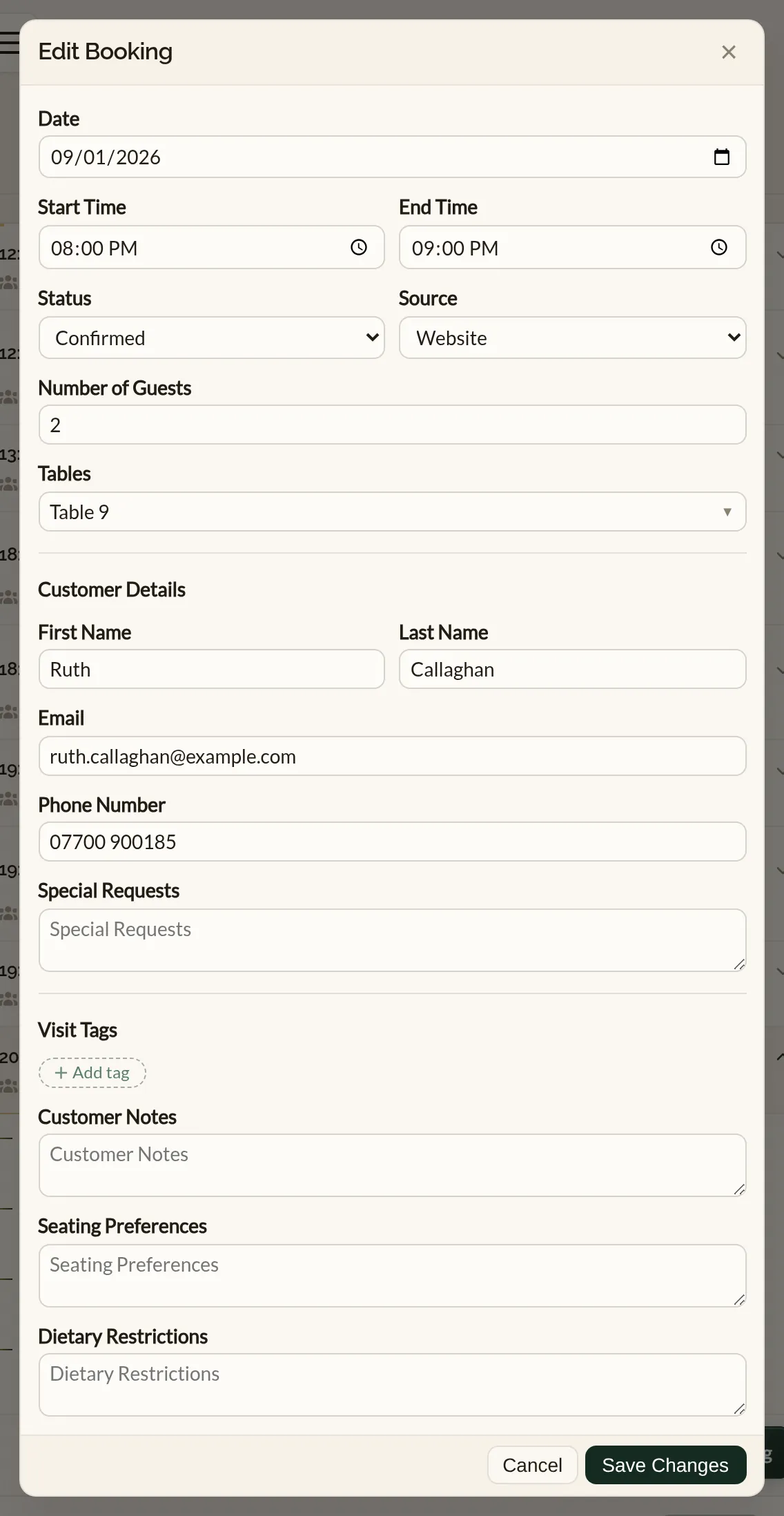 The Edit Booking form in the Make a Rezzy management app, pre-filled with a booking's date, times, status, party size, tables and guest details