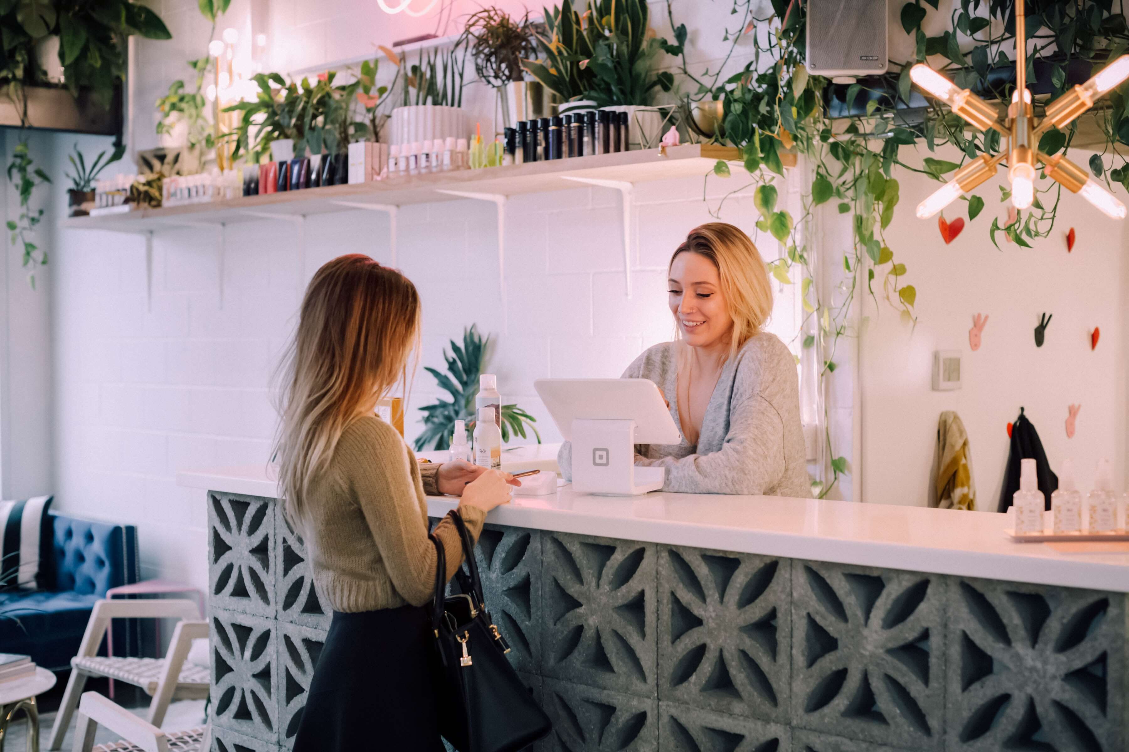 Woman at a desk helping a customer